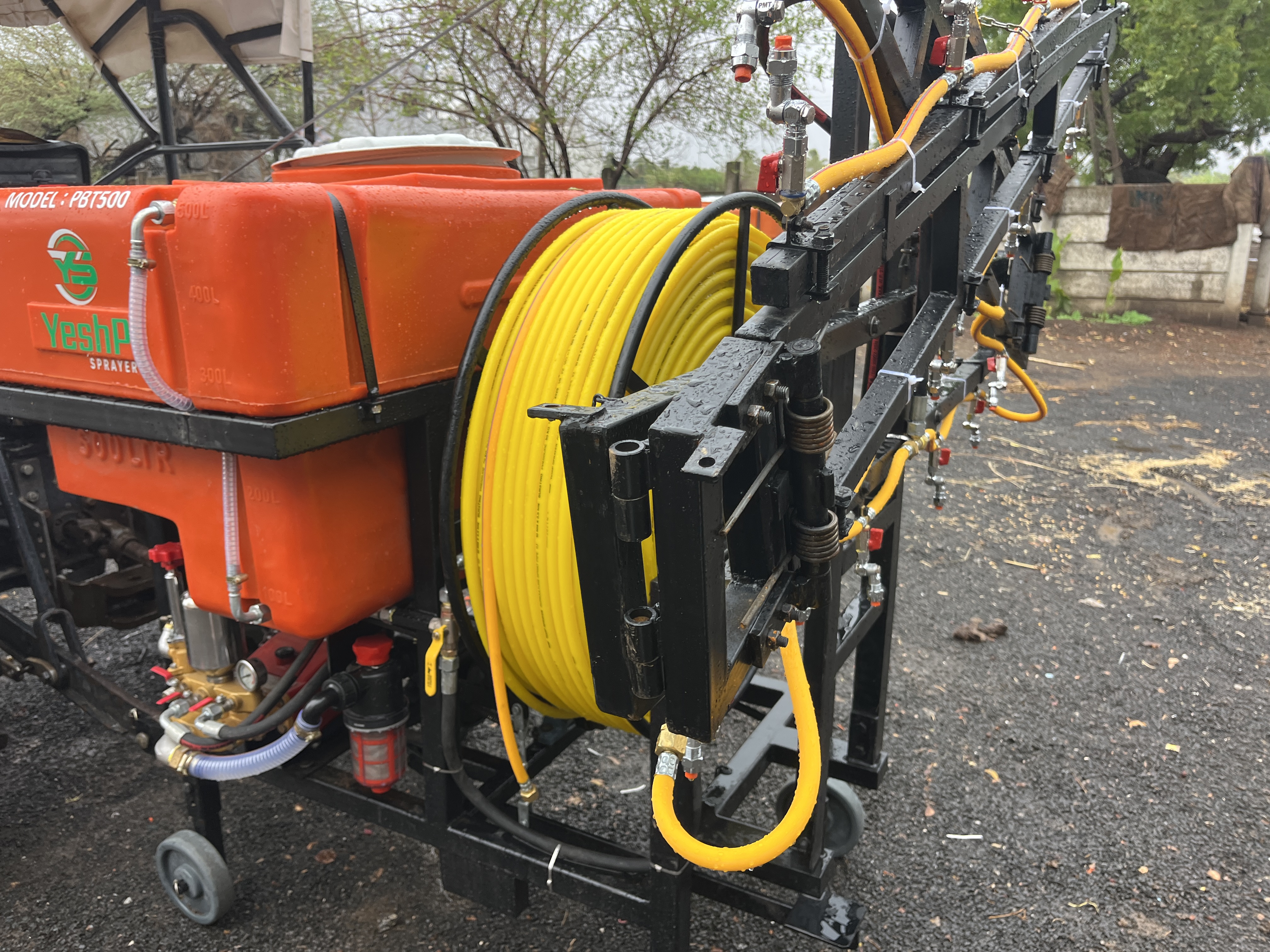 Close view of the YeshP Sprayer hose reel and spray boom